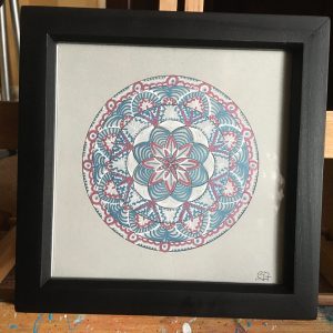 Pink and blue Mandala in acrylic pen on card - 7" x 7" in small black box frame by Carolyn Freeman