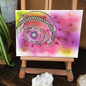 Black on pink and yellow Mandala in acrylic pen on canvas - 12" x 9" by Carolyn Freeman