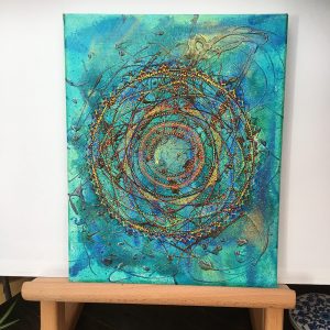 Brown, yellow and black on blue Mandala in acrylic pen on canvas - 12" x 8" by Carolyn Freeman