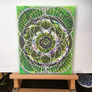 Black and white on green Mandala in acrylic pen on canvas - 12" x 8" by Carolyn Freeman